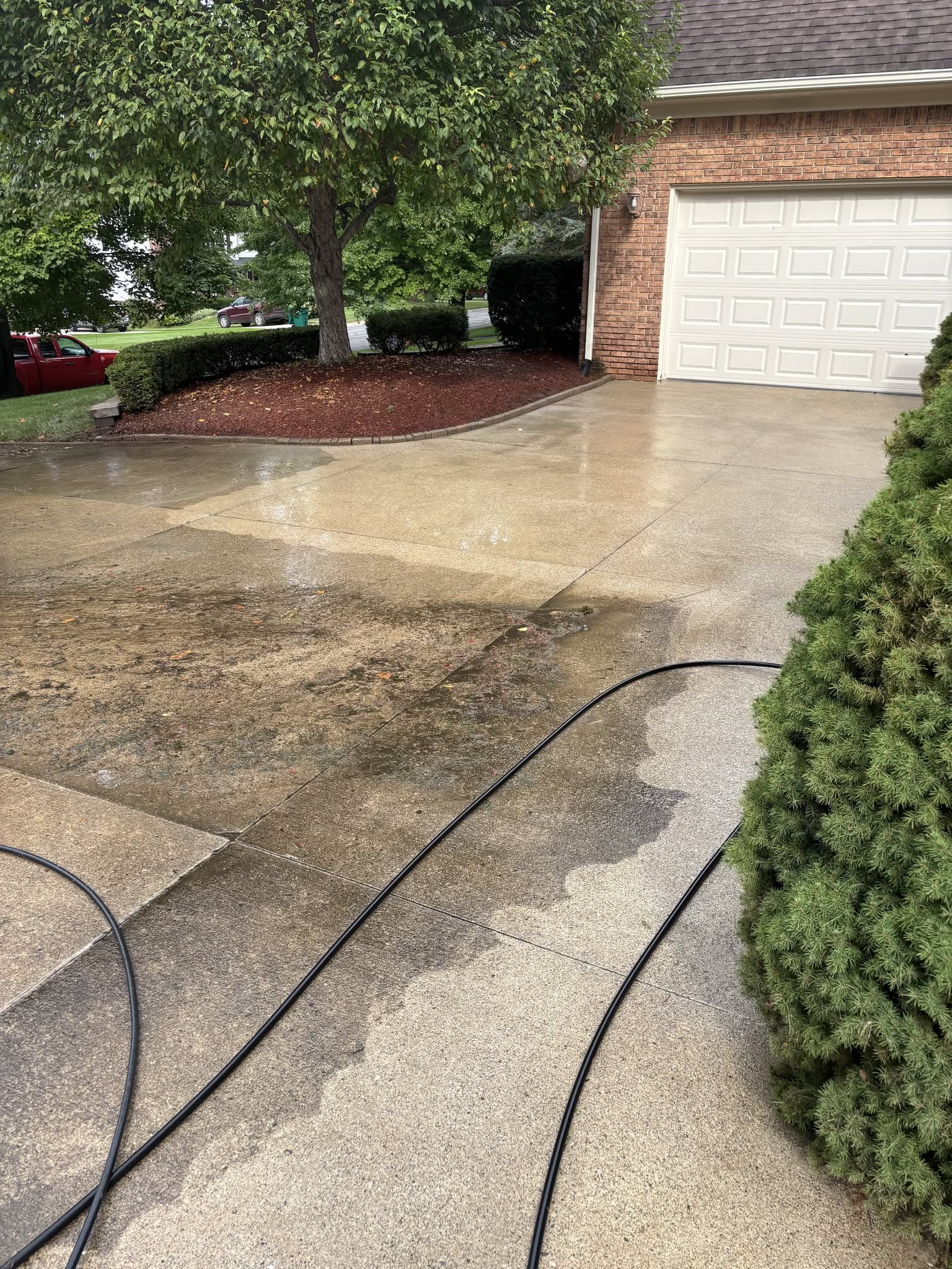 Driveway exterior maintenance and concrete cleaning in Fenton, MI by Jaybird Construction